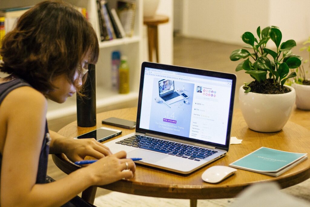 IMAGE: Sitting at desk using computer