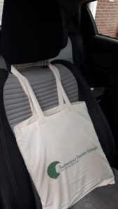 Tote bag with pillow used as back support while driving