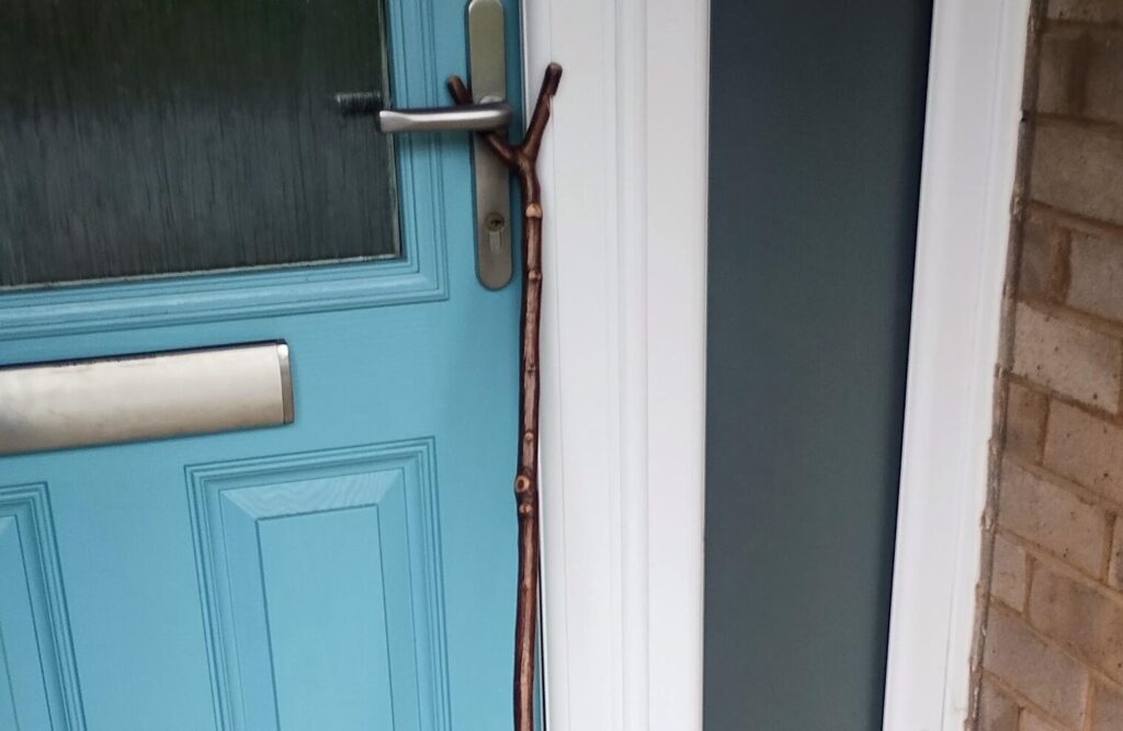 walking staff by front door