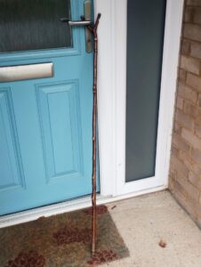 Thumb stick by front door