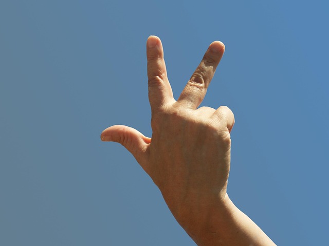 hand showing three fingers